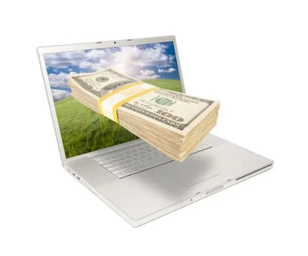 Laptop with Stack of Money Coming From Screen Foto stock