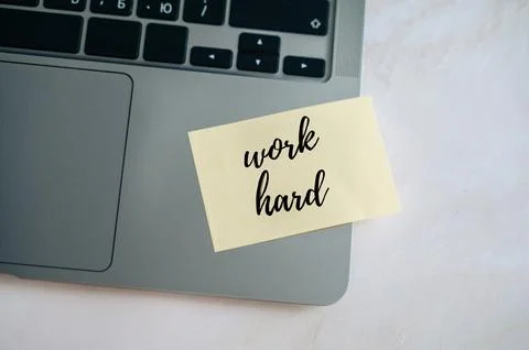 Laptop with sticker hard work Stock Photos