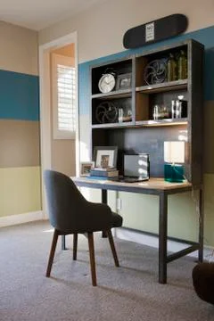 Laptop on study table in average house Stock Photos