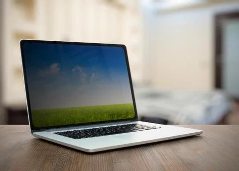 Laptop on table in the bedroom Stock Photos