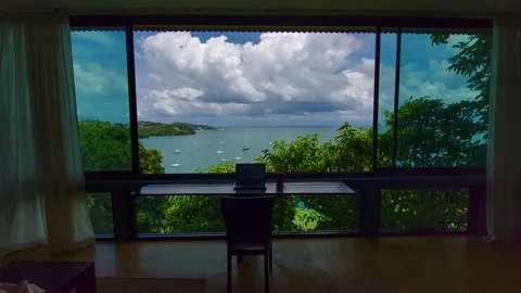 Laptop on the table, the concept of remote work in the tropics Stock Footage 172475037