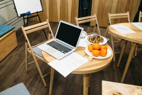 Laptop on the table in an educational institution Stock Photos