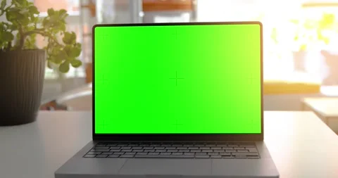 Laptop on a table with a green screen, perfect for adding content in post-p.. Stock Footage 282703011