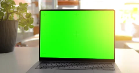 Laptop on a table with a green screen, perfect for adding content in post-p.. Stock Footage 282703018