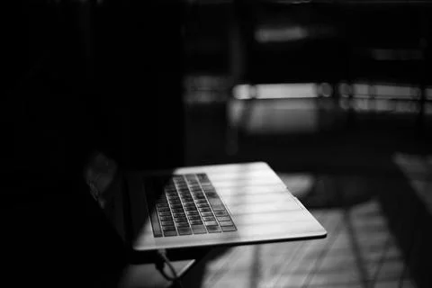 Laptop on the table in the interior of the apartment Stock Photos