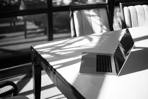 Laptop on the table in the interior of the apartment Stock Photos