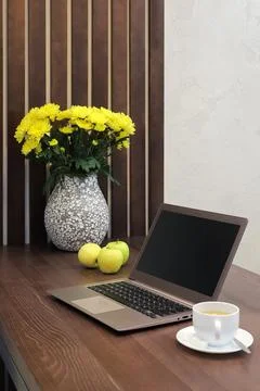 Laptop on table in kitchen interior Stock Photos