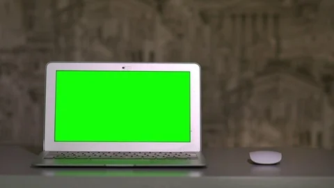 The laptop is on the table, lying next to the mouse the chromakey 스톡 동영상 70382533