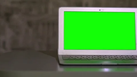 The laptop is on the table, lying next to the mouse the chromakey Stock Footage 70407921