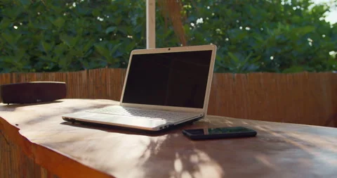 Laptop on table in tropical cafe - bar for remote working Video stock 254778016