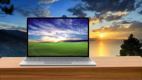 Laptop on the table for wallpaper with a sunset view Stock Illustration