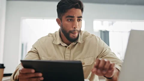 Laptop, tablet and problem solving with a business man in his office, working on Stock Footage 237143561