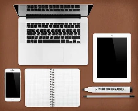 Laptop tablet, notepad and smartphone on the desk Foto stock