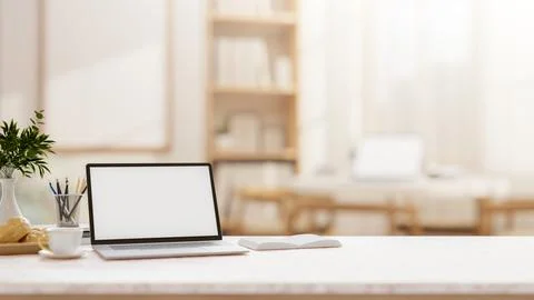 A laptop on a tabletop with a blurred background of a comfortable, minimali.. Stock Illustration