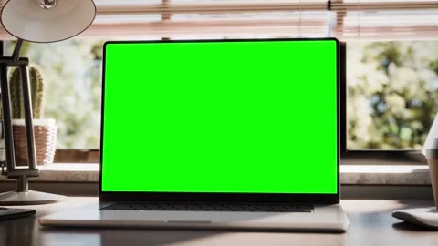 Laptop template with a blank screen placed on a wooden desk in a loft-style.. Stock-Footage 272451242