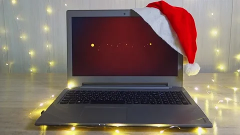 Laptop with text on the screen Happy New Year. Laptop on an empty table against Video stock 143058910