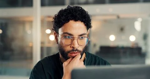 Laptop, thinking and web design with man in office at night for problem solving Stock Photos