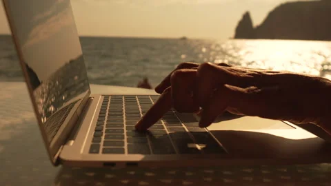 Laptop typing sunset, hands working on computer at ocean beach for remote work Vidéo 313983864