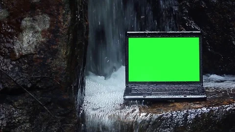 Laptop under waterfall Stock Footage 70524513