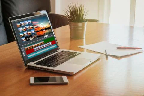 Laptop with a video edit project in the screen. Stock Photos