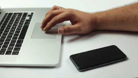 A laptop on a white background, a hand presses the touch panel Stock Footage 245851941
