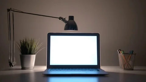 Laptop with a White Screen on the Table at Night Stock Footage 84535753