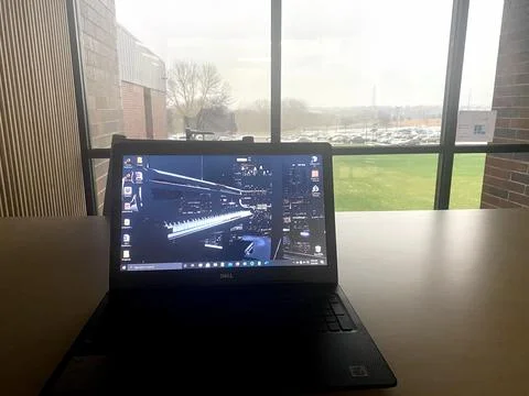 Laptop by Window Foto stock