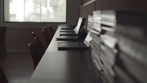 Laptops and books put in the computer lab in the school for students Stock Footage 233062601
