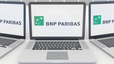 Laptops with BNP Paribas logo on the screen. Computer technology conceptual Illustrazione stock