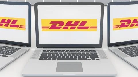 Laptops with DHL Express logo on the screen. Computer technology conceptual Stockillustratie