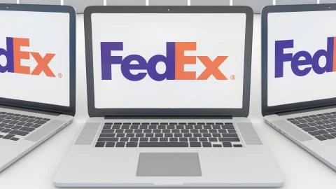 Laptops with FedEx logo on the screen. Computer technology conceptual editorial Stock Illustration