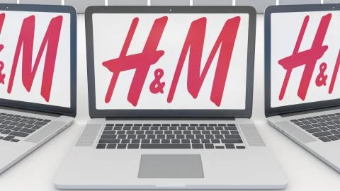 Laptops with H M logo on the screen. Computer technology conceptual editorial 3D Stock Illustration