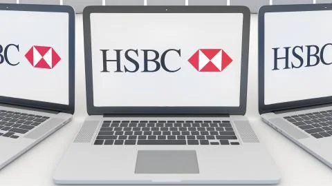 Laptops with HSBC logo on the screen. Computer technology conceptual editorial Illustrazione stock