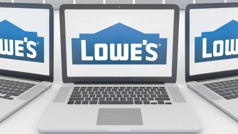 Laptops with Lowe's logo on the screen. Computer technology conceptual editorial Illustrazione stock