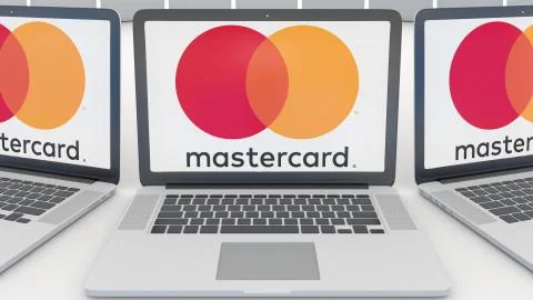 Laptops with MasterCard logo on the screen. Computer technology conceptual Illustrazione stock
