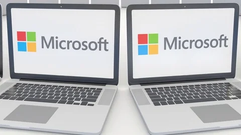 Laptops with Microsoft logo on the screen. Computer technology conceptual Stock Footage 73112990
