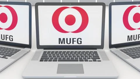 Laptops with MUFG logo on the screen. Computer technology conceptual editorial Illustrazione stock