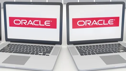 Laptops with Oracle Corporation logo on the screen. Computer technology Stock Footage 73116107