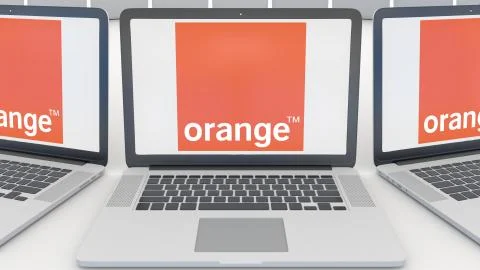 Laptops with Orange S.A. logo on the screen. Computer technology conceptual Stock Illustration