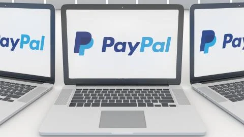 Laptops with PayPal logo on the screen. Computer technology conceptual editorial Illustrazione stock