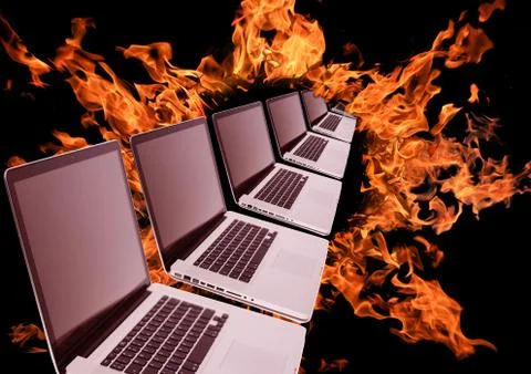 Laptops row in fiery ring Stock Photos