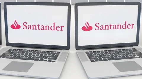 Laptops with Santander Serfin logo on the screen. Computer technology conceptual Stock Footage 73118372