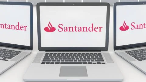 Laptops with Santander Serfin logo on the screen. Computer technology conceptual Stock-Illustration