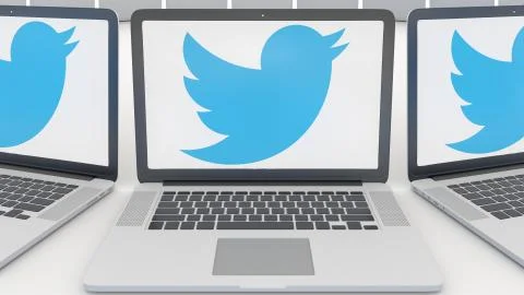 Laptops with Twitter, Inc. logo on the screen. Computer technology conceptual Illustrazione stock