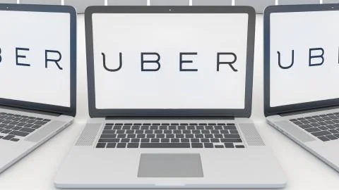 Laptops with Uber Technologies Inc. logo on the screen. Computer technology Stock-Illustration