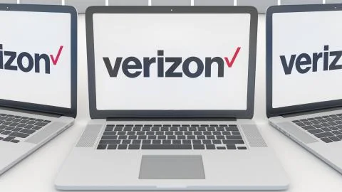Laptops with Verizon Communications logo on the screen. Computer technology Illustrazione stock