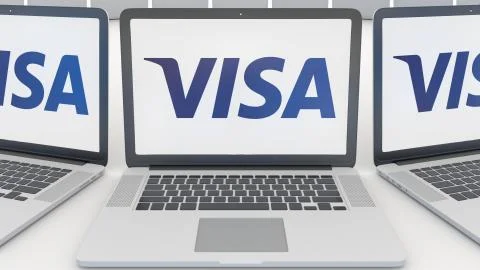 Laptops with Visa Inc. logo on the screen. Computer technology conceptual Illustrazione stock