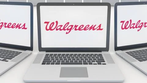 Laptops with Walgreens logo on the screen. Computer technology conceptual Illustrazione stock