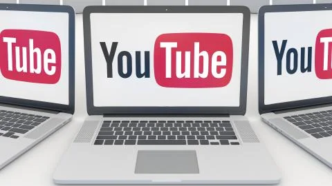 Laptops with YouTube logo on the screen. Computer technology conceptual Illustrazione stock