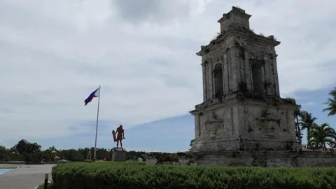 Lapu Lapu, Magellan monument and flag of the Philippines seen from rear Stock Footage 245046015